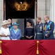 (L-R) Prince Charles, Prince of Wales, Camilla, Duchess of Cornwall, Prince Andrew, Duke of York, Queen Elizabeth II, Meghan, Duchess of Sussex, Prince Harry, Duke of Sussex, Prince William, Duke of Cambridge and Catherine, Duchess of Cambridge watch the RAF flypast on the balcony of Buckingham Palace to mark the centenary of the RAF on July 10, 2018 in London, England.